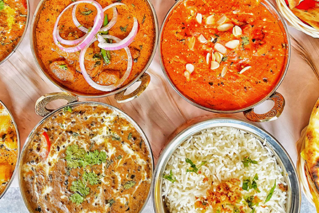 Variety of Indian dishes served on a thali platter.